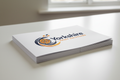 Stack of custom printed leaflets with Yorkshire Print Solutions branding on a desk